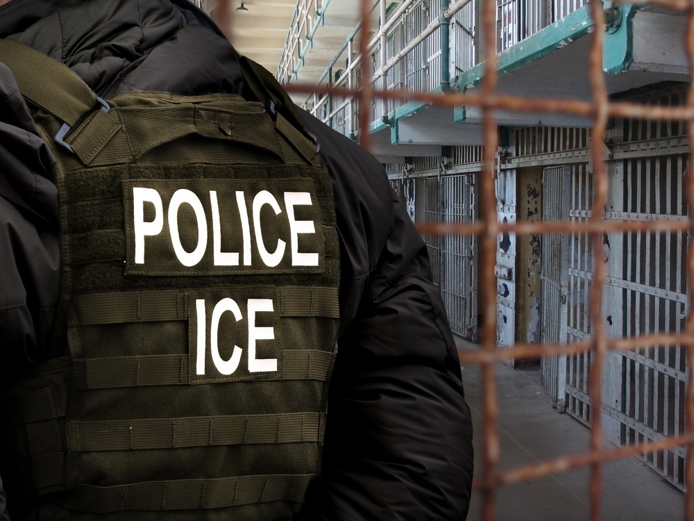 An,Immigration,And,Customs,Enforcement,(ice),Officer,Stands,In,Front